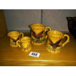 A set of 4 Eagle measure cups by Chadwick. Includes 1, 1/2, 1/4 and 1/8 measures