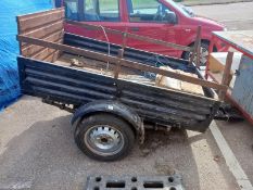 A 6" x 4" single wheel trailer with metal sides & wood base. Collect Only.