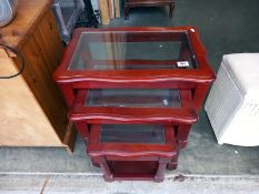 A nest of 3 tables with glass inserts. Collect Only.