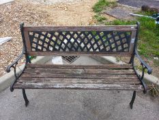 A wooden garden bench with metal legs & lattice back. Collect Only.