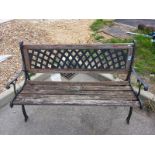 A wooden garden bench with metal legs & lattice back. Collect Only.