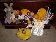 A large quantity of cuddly toys and a Doll Christmas tree topper