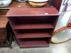 A dark brown 4 shelf bookcase. 70cm x 22cm x 91cm. Collect Only.