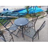 A glass top garden table & 4 chairs. Collect Only.