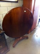 A Victorian mahogany tip up dining table. COLLECT ONLY.