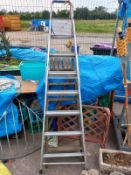 An aluminium step ladder & a decorative wooden ladder. Collect Only.