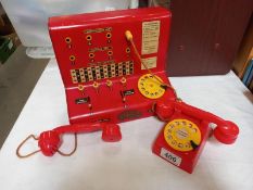 A vintage tinplate CODEG toytown telephone exchange