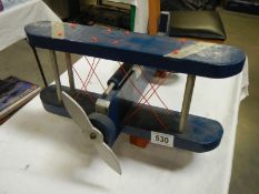 A scratch built painted wooden Biplane