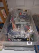 Approximately 10 car plastic model kits. No boxes, no instructions, unchecked for completeness