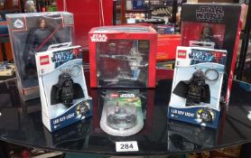A selection of Star Wars figures and Lego Darth Vader keyrings