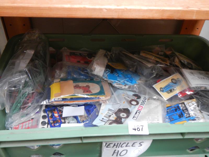Approximately 30 plastic model kits of commercial vehicles and cars. Unboxed, no instructions,