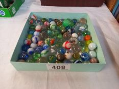 A tray of vintage marbles