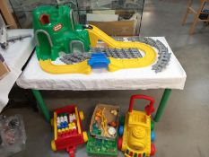 A Max brick baby walker and trailer with Lego style bricks etc, including little Tikes railway
