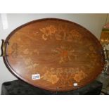 An oval marquetry inlaid tray.