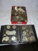 A mixed lot of coins and an album of coins.