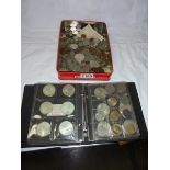 A mixed lot of coins and an album of coins.