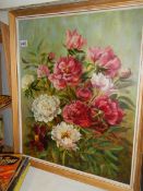 A mid 20th century oil on board painting of flowers.