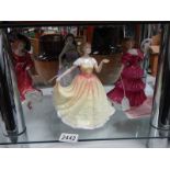 Four Royal Doulton figurines.