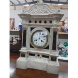 A Victorian French white marble style mantel clock.