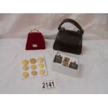 A mixed lot including button's, cuff links, miniature hand bag.