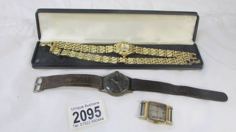 A wrist watch with matching bracelet, another wristwatch and a watch head.