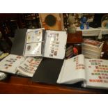 Four ring binders of assorted stamps.