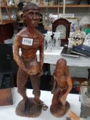 Two carved wood figures.