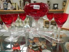 A large red glass bowl, set of 6 red glasses and two other glasses.