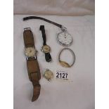 A quantity of wrist watches and a pocket watch.