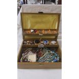 A jewellery box and a mixed lot of costume jewellery.