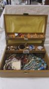 A jewellery box and a mixed lot of costume jewellery.