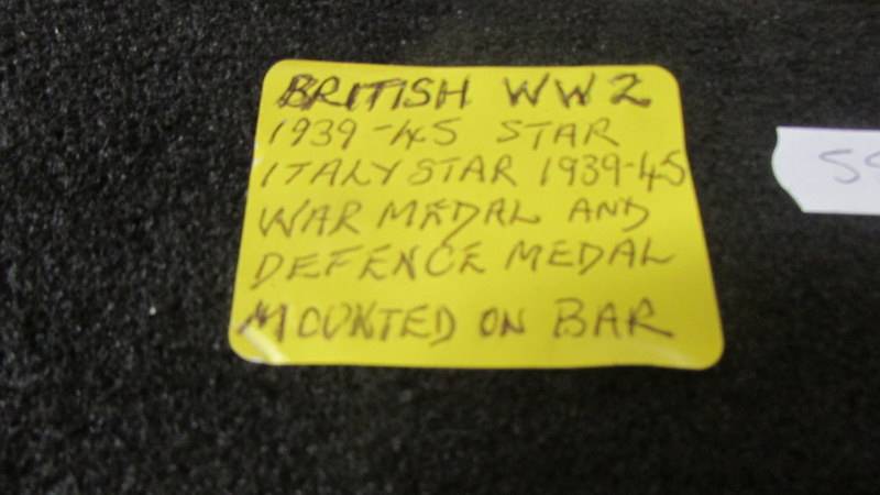 A set of WW2 medals mounted on a bar. - Image 2 of 2