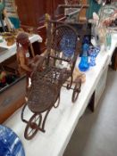 A Victorian style dolls push chair.