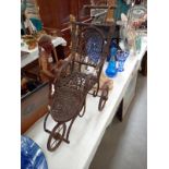 A Victorian style dolls push chair.