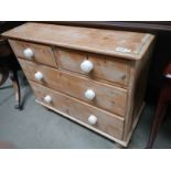 An old stripped pine 2 over 2 chest of drawers with ceramic knobs, COLLECT ONLY.