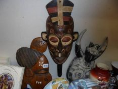 Three wooden wall masks.