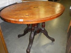 An oval inlaid tip top table. COLLECT ONLY.