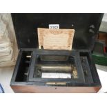 A Victorian four tune music box in good working order.