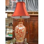 A hand painted table lamp.