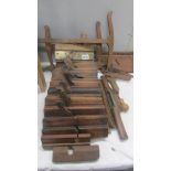 A quantity of old woodworking planes.