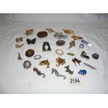 A mixed lot of brooches including animal examples.