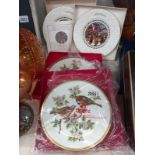 Two Spode bird plates and two Coalport Christmas plates.