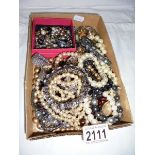 A mixed lot of bracelets, necklaces etc.,