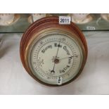 A cased ship's barometer.