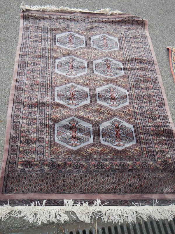 An old rug, 147 x 99 cm.