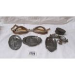Three metal trays depicting scenes of Bolton and 2 pairs of vintage goggles.