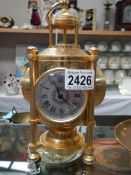 A 20th century brass ship's style clock.
