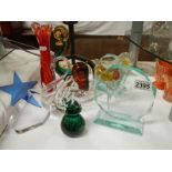 A mixed lot of glass paperweights.