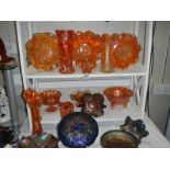 Three shelves of good carnival glass in good condition.