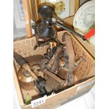 A good box of metal ware including blow lamps, irons etc.,